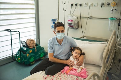 Yaqeen Kankar, with her father Ibrahim Kankar, began treatment at Al Jalila hospital in Dubai in July. Antonie Robertson / The National