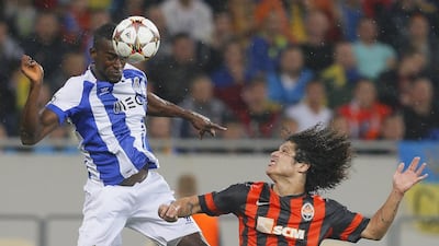 Jackson Martinez, left, of FC Porto in action against Marcio Azevedo of Shakhtar Donetsk during their Champions League match on Tuesday in Ukraine. Sergey Dolzhenko / EPA