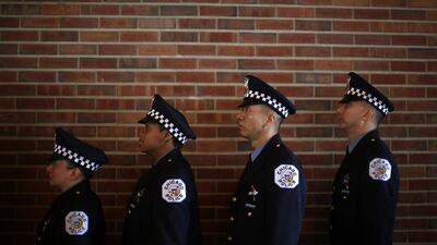 Chicago Police officers line up to be presented their certificates during the graduation ceremony for the Department’s newest recruits in Chicago, Illinois, April 21, 2014. Jim Young /Reuters