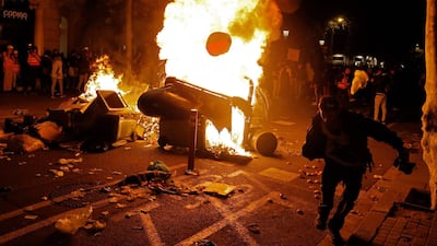 Pro-independence Catalan protesters burn barricades after a previous protest called by the local Republic Defence Committees (CDR) in Barcelona on October 17, 2019. After years of peaceful separatist demonstrations, violence finally exploded on the Catalan streets this week, led by activists frustrated by the political paralysis and infuriated by the Supreme Court's conviction of nine of its leaders over a failed independence bid. / AFP / Pau Barrena
