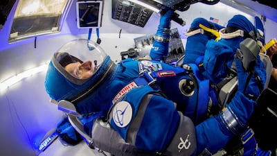 Former Atlantis shuttle commander Chris Ferguson models Boeing's new spacesuit in a mock up of the Starliner capsule. Boeing