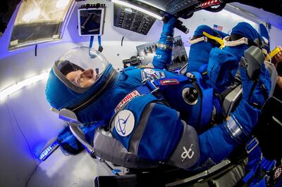 Former Atlantis shuttle commander Chris Ferguson models Boeing's new spacesuit in a mock up of the Starliner capsule. Boeing
