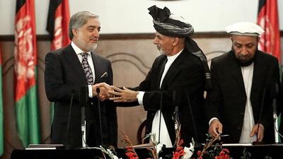 Afghan President Ashraf Ghani, second left, was sworn in as Afghanistan’s new president on Monday. He is seen here shaking hands with chief executive Abdullah Abdullah, left, during his inauguration ceremony at the presidential palace in Kabul, Afghanistan. Rahmat Gul/AP Photo