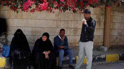 Members of African communities in Yemen gather outside the headquarters of the UN migration agency in Sanaa Yemen, 13 March 2021. EPA