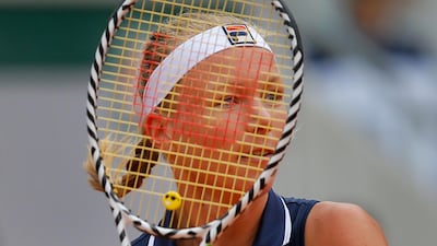 Netherlands' Kiki Bertens eyes the ball as she returns a shot against Slovakia's Viktoria Kuzmova during their second round match. Michel Euler / AP Photo