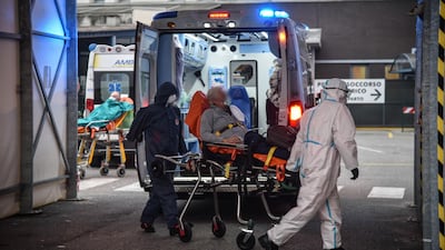 Ambulances transport Covid-19 patients to the entrance to the emergency room of the San Gerardo hospital in Monza.
