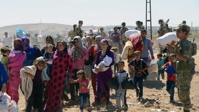 The UN refugee agency (UNHCR) said on Sunday that at least 70,000 Syrians crossed into Turkey in the past 24 hours - before the border was temporarily closed. AP Photo