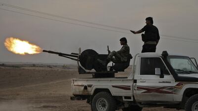 Turkish-backed Syrian fighters fire a truck mounted heavy gun near the town of Tukhar, north of Syria's northern city of Manbij, as Turkey and it's allies continues their assault on Kurdish-held border towns in northeastern Syria. Turkey wants to create a roughly 30-kilometre (20-mile) buffer zone along its border to keep Kurdish forces at bay and also to send back some of the 3.6 million Syrian refugees it hosts. AFP