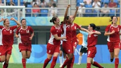 Candace Chapman (fourth right), celebrates her goal in the 27th minute.
