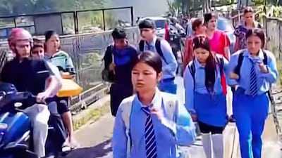 Pupils flee after floodwaters crashed into the school on August 26. Harisharan Gajurel / Facebook