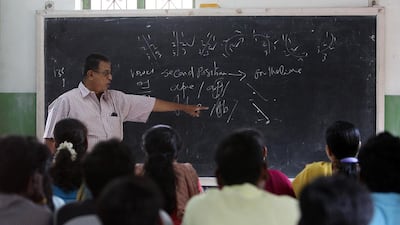 An instructor teaches Tamil and English shorthand to students at the Stenographers Guild Institute in Chennai. The Tamil language contains some surprising – and eloquent – terms for truth. Pawan Singh / The National
