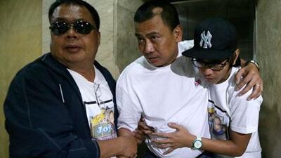 Joseph Balmaceda, centre, is one of four Filipino oil field workers who was wounded but survived the hostage crisis at an oil field in Algeria. Bullit Marquez / AP Photo