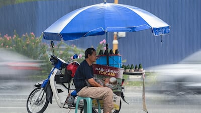 A vendor sells the popular Malay dish nasi lemak in Kuala Lumpur. AFP
