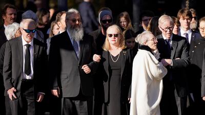 Members of the Carter family watch as the casket arrives at the Jimmy Carter Presidential Library and Museum. EPA
