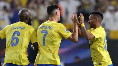 Cristiano Ronaldo celebrates scoring with Al Nassr teammates. Reuters