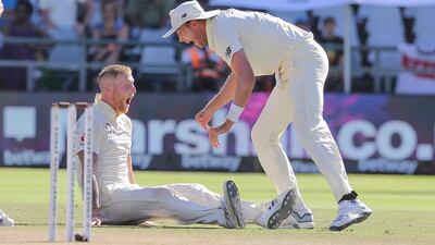 Ben Stokes, left, and Stuart Broad celebrate the wicket of Anrich Nortje. AP