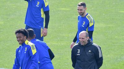 Juventus coach Massimiliano Allegri jokes with his players during a training session for the Villareal match. EPA