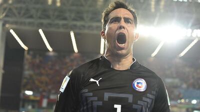 Chile goalkeeper Claudio Bravo celebrates as his team beats Australia 3-1 at the 2014 World Cup on Friday. Luis Acosta / AFP