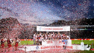 Ajax players celebrate their Dutch Eredivisie football league title after the match after beating De Graafschap in Doetinchem. Netherlands. AFP