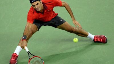 Roger Federer will face Novak Djokovic in the semi-finals at the Shanghai Masters tournament held in the Qizhong Tennis Stadium. Goh Chai Hin / AFP