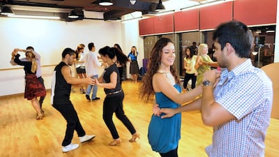 Synthia Agudeto and Ajit Aggarwal, in the forefront, at Capella Club's Salsa class taught by Luis Gabriel Usma. Charles Crowell for The National