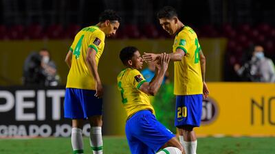 Brazil's Marquinhos, Danilo and Roberto Firmino celebrate at the final whistle. AFP