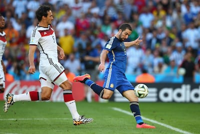 Gonzalo Higuain of Argentina shoots wide as Mats Hummels of Germany defends during the 2014 Fifa World Cup final at the Maracana stadium in Rio de Janeiro on July 13, 2014. Getty