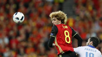 Marouane Fellaini (L) of Belgium and Marco Parolo of Italy in action during the Uefa Euro 2016 group E preliminary round match between Belgium and Italy at Stade de Lyon in Lyon, France, 13 June 2016. Sergey Dolzhenko / EPA
