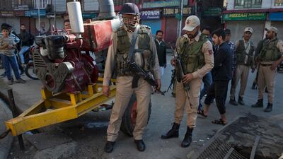 Indian policemen inspect the site of an explosion in Srinagar, the main city in Kashmir, that injured at least seven people on October 12, 2019. AP Photo