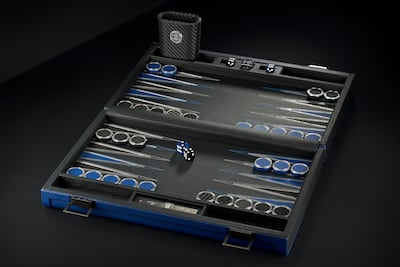 The set’s 20 checkers are encircled with black diamonds or blue sapphires, as are the 24 arrows edges on the board. Photo: S by Salanitro