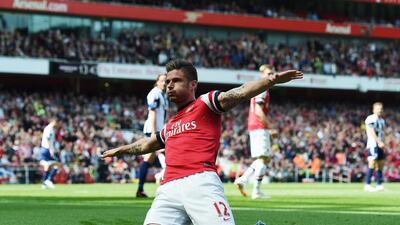 Olivier Giroud of Arsenal celebrates after scoring during the Premier League match against West Bromwich Albion at the Emirates Stadium on May 4, 2014. Shaun Botterill / Getty Images