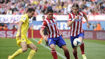 Brazilian defender Filipe Luis, right, signed with Chelsea on Wednesday, July 16, 2014. He played an instrumental role with Atletico Madrid during their Uefa Champions League title run last year. AFP PHOTO / PEDRO ARMESTRE
