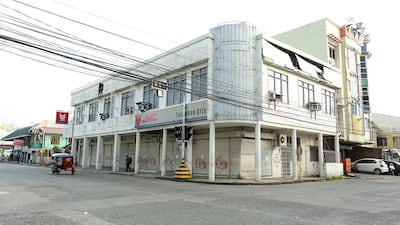 Aiza Tonida used to work in this commercial building in Tacloban City. The company where Ms Tonida worked ceased operations after Typhoon Haiyan. (Joey Reyna for The National / April 10, 2014)