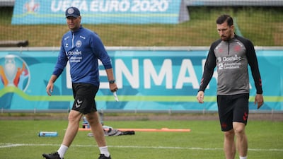 Denmark's Pierre-Emile Hojbjerg and coach Kasper Hjulmand during a training session. Reuters