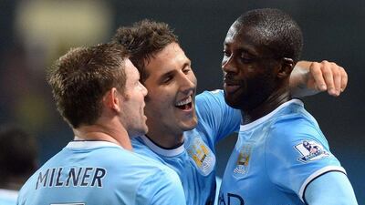 Yaya Toure, right, and Stevan Jovetic scored for a new-look Manchester City line-up. Andrew Yates / AFP