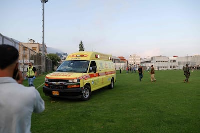 Israeli security forces and medics transport casualties. AFP