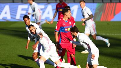 Real Madrid's Karim Benzema celebrates scoring their first goal with teammates. reuters