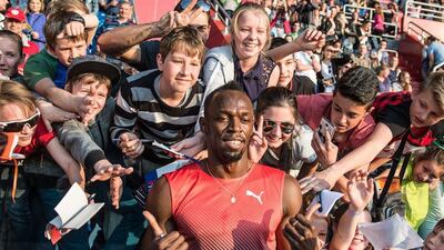 Usain Bolt poses with young fans at the Czech Golden Spike meet. Filip Singer / EPA
