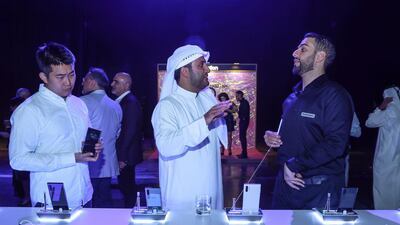 Visitors get their hands on the device.