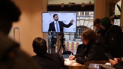 Members of the media watch Mr Vance speak at the conference. Getty Images