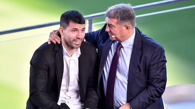Sergio Aguero and Barcelona president Joan Laporta. AFP