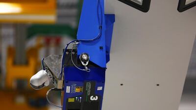 An automatic quality control machine scans the 777X spar for defects in carbon fiber.