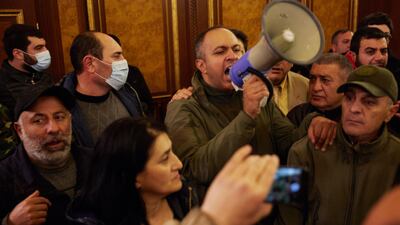 Protestors storm Armenian Prime Minister Nikol Pashinian's office after the announcement of a peace deal in the war between Armenia and Azerbaijan in Yerevan. Getty Images