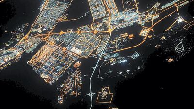 Jessica Meir snapped this image of Abu Dhabi from the International Space Station - 400km above Earth. Mussaffah and Khalifa City can be seen in the lower left and the green lights of Riyadh City on the upper right. Jessica Meir / Nasa