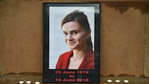 Candles surround a photo of Labour MP Jo Cox before a vigil in her memory in Glasgow in 2016. Cox was murdered by a white supremacist a day earlier. Getty