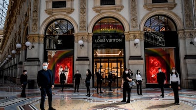 Market vendors protest rules that do not allow them to restart their activity, at the Galleria Vittorio Emanuele II shopping arcade in Milan, Italy. AP