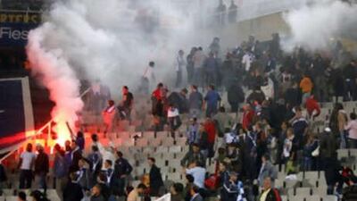 Crowd trouble breaks out between Espanyol and Barcelona fans in the first Catalan derby of the season.