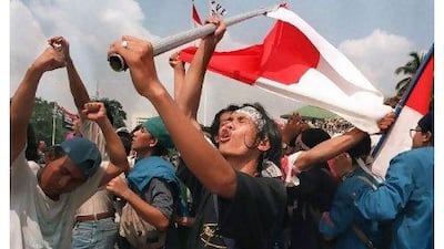 Students celebrate the resignation of Indonesian President Suharto at the parliamentary complex in Jakarta in 1998. Kemal Jufri / AFP