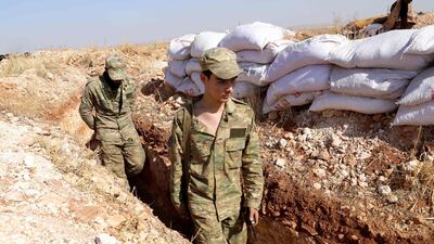 Syrian rebels from the National Liberation Front on the front line with regime areas in the southern countryside of Aleppo, near Ildib. AFP
