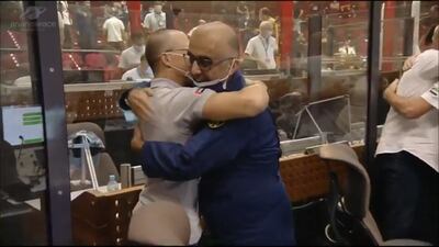 UAE space officials and the French team celebrate at mission control after successful launch